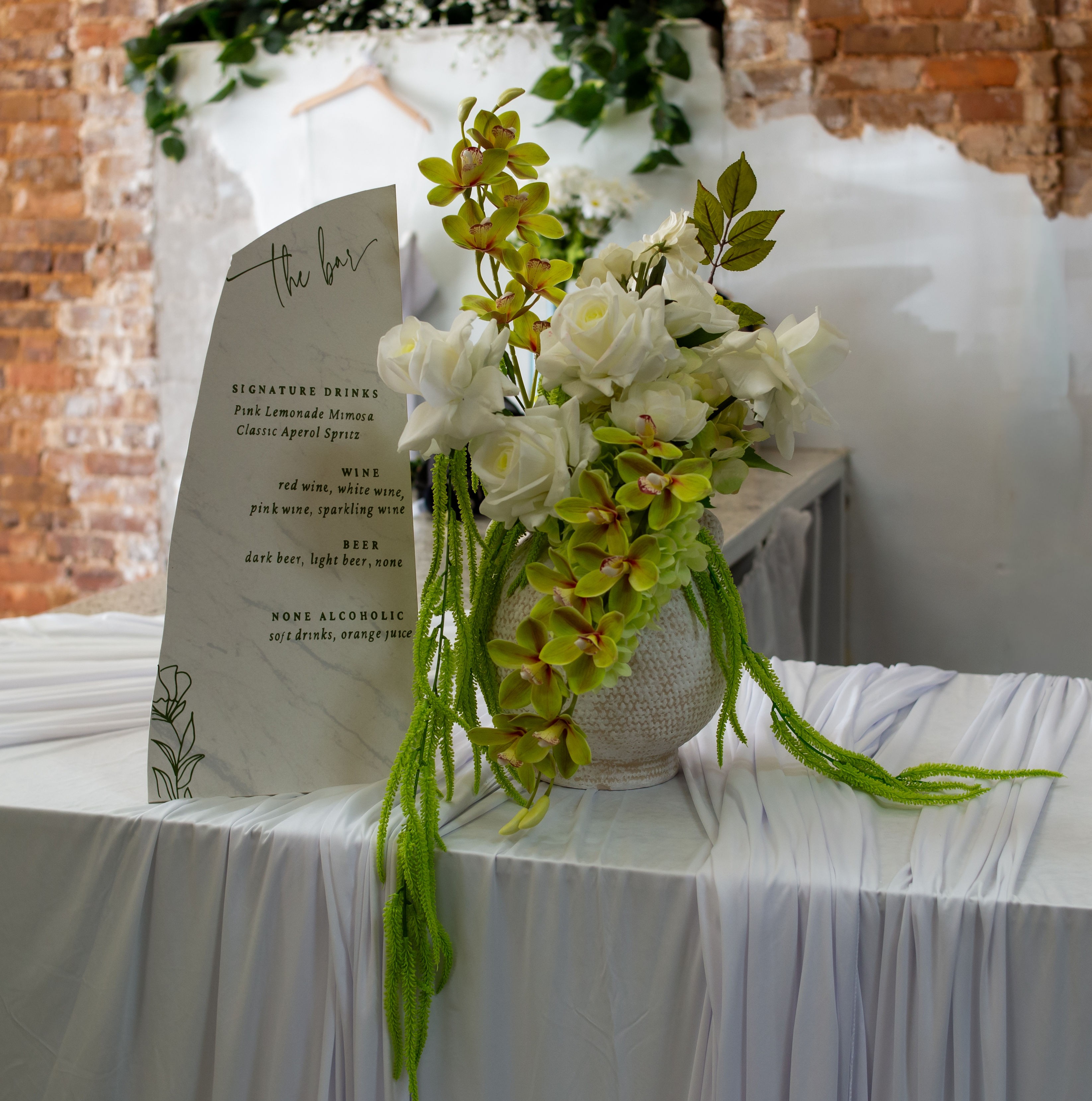 Cropped photo of the exterior of the top floor of an old stone building.