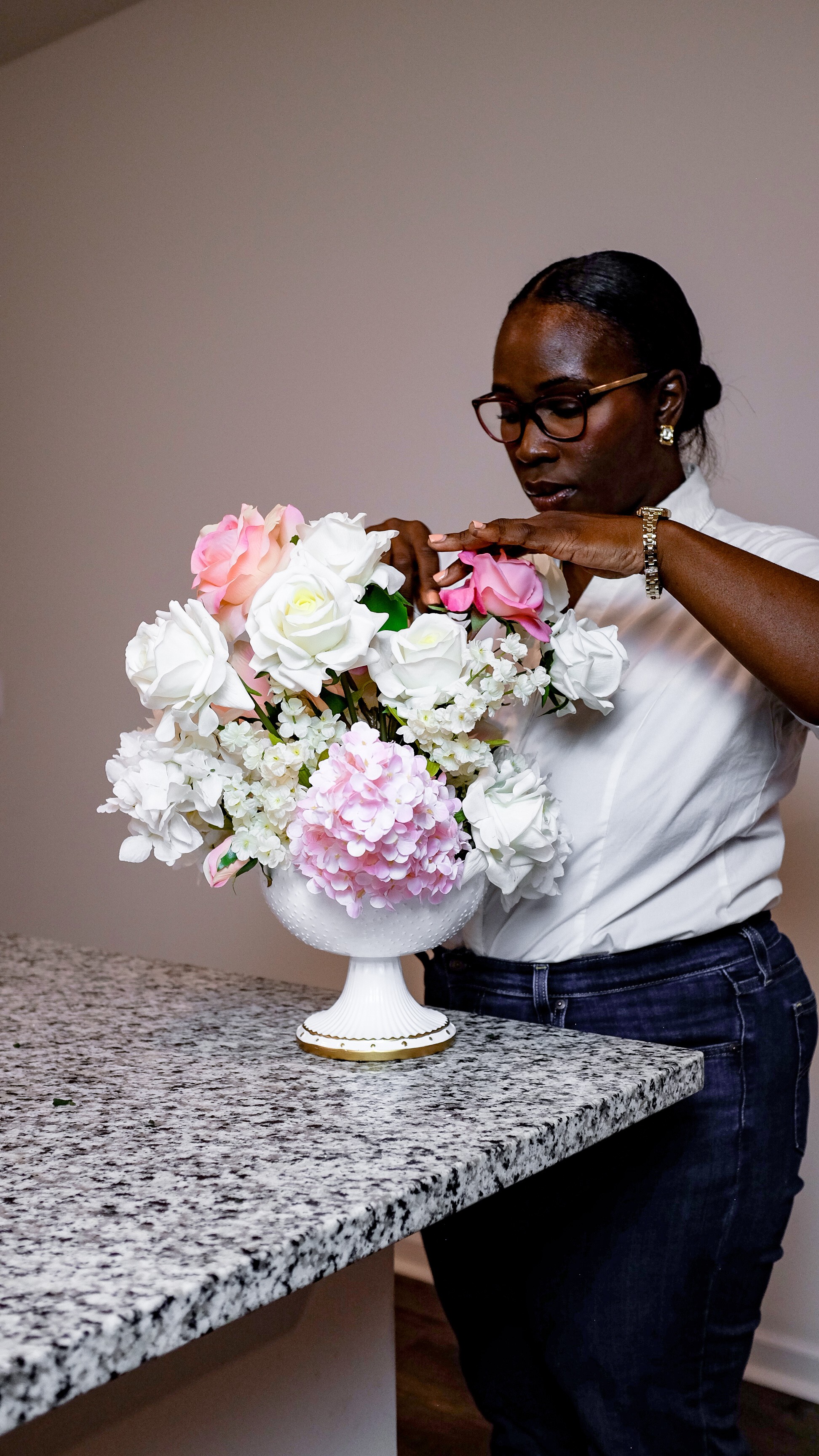A pear set on a yellow plate upon a soft white canvas texture.