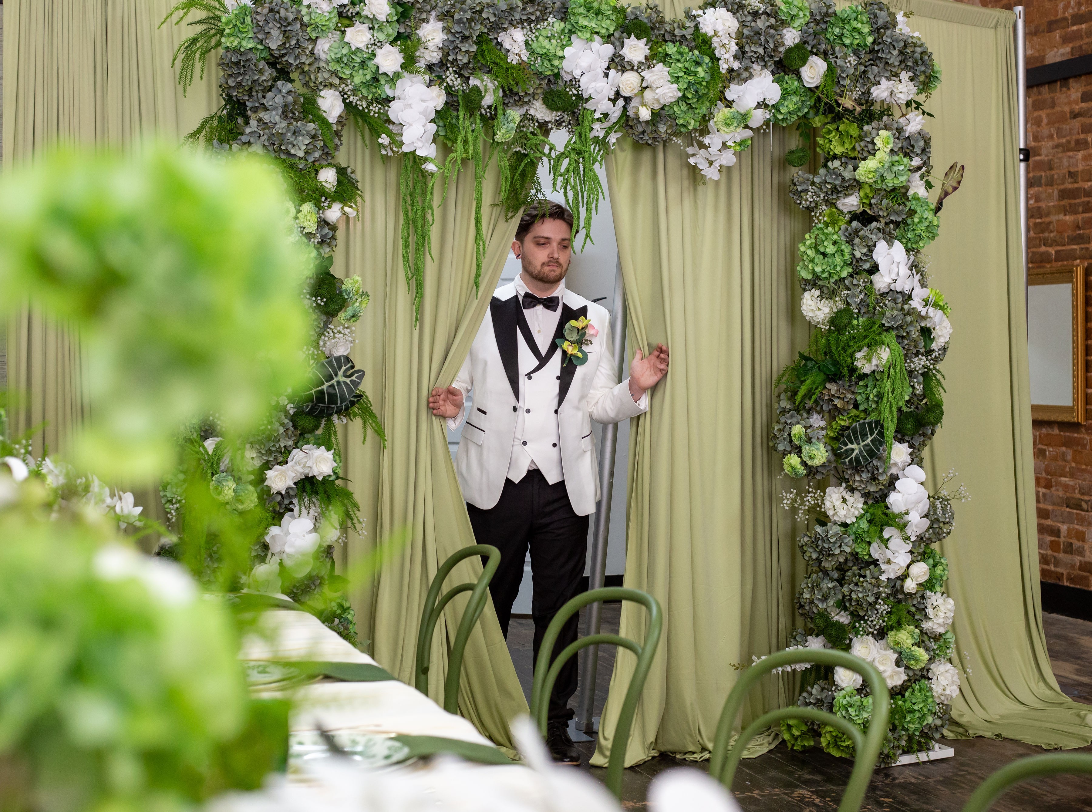 A dried flower rested upon wrinkled pieces of cloth paper.