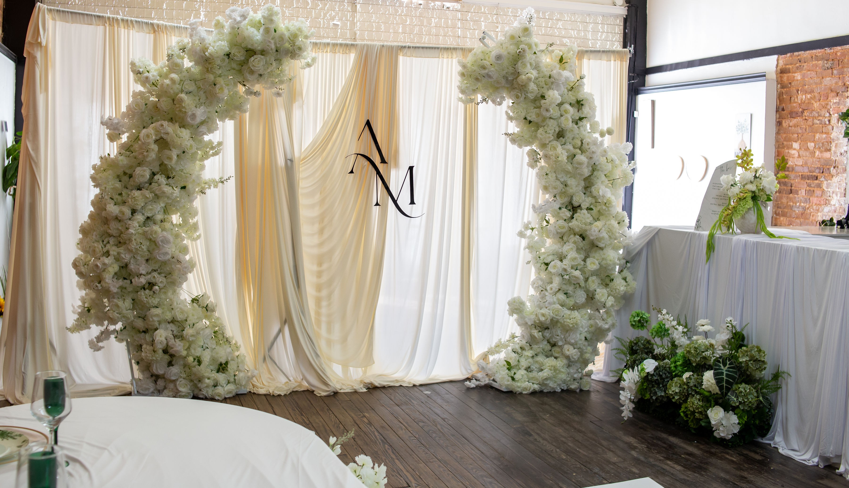 Delicate flowers taped to a wall.